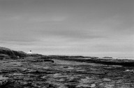 Bamburgh Beach with the lighthouse in the distance